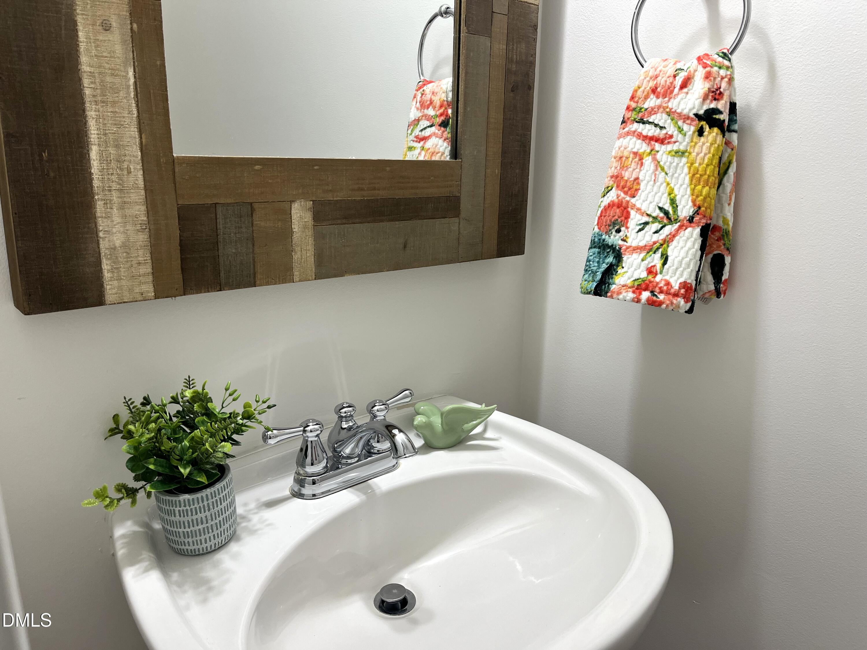 4815 Landover Charge Lane Raleigh, NC 27616 - Photo 6 of 18 a bathroom with a sink and mirror