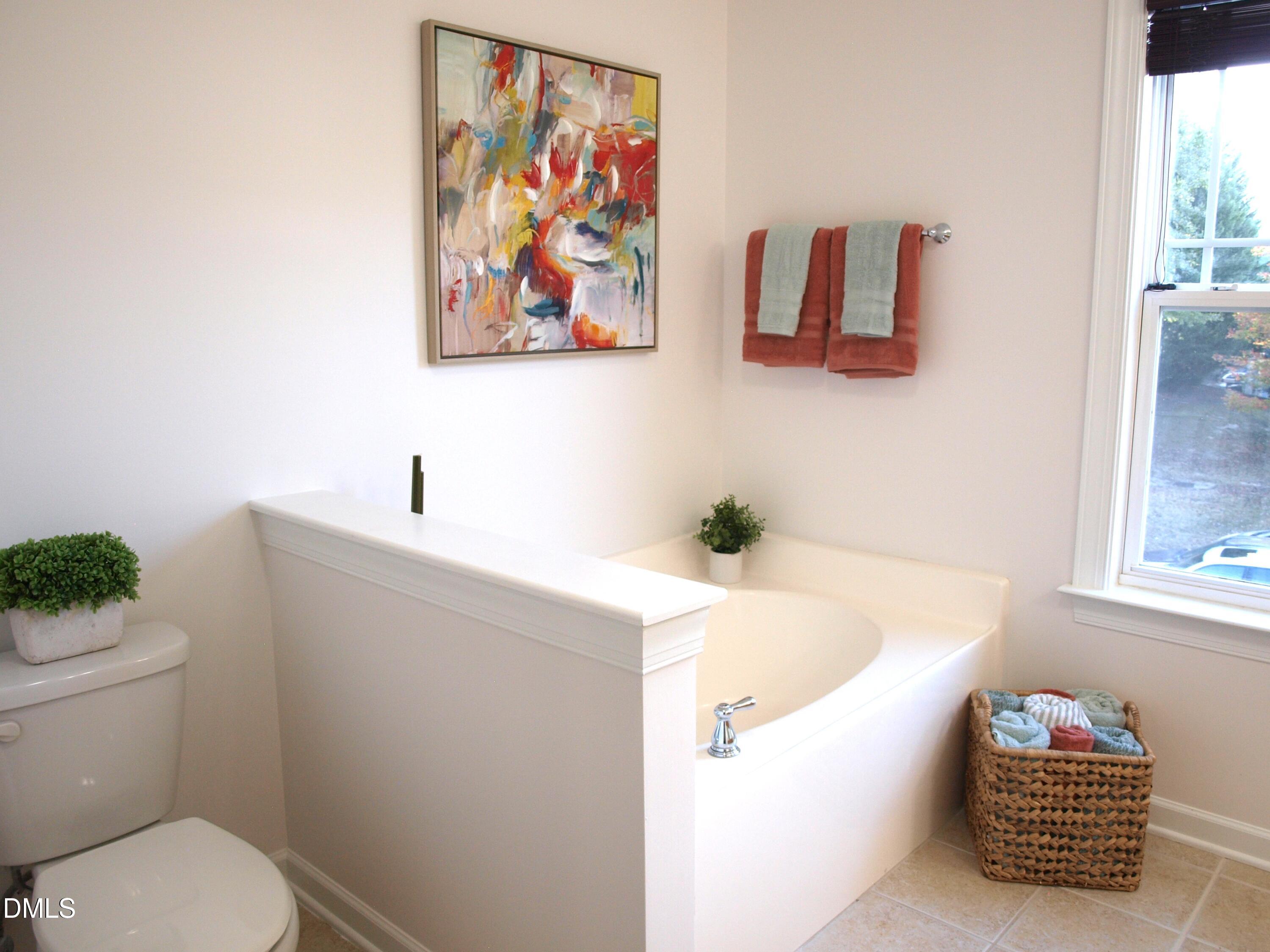 4815 Landover Charge Lane Raleigh, NC 27616 - Photo 10 of 18 a bathroom with a sink and a mirror