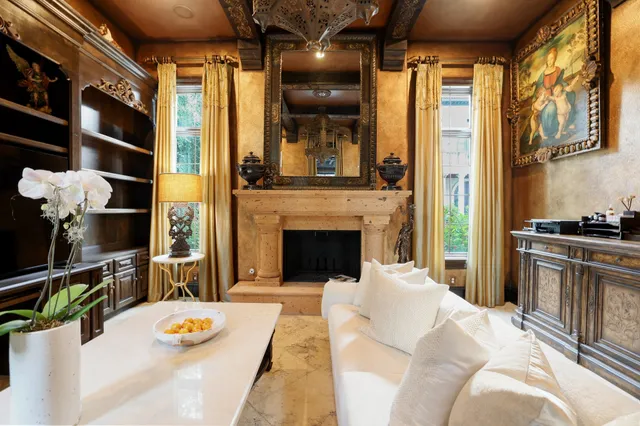 a bedroom with furniture and a chandelier