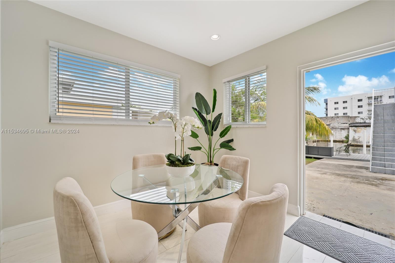 805 Northwest 7th Street Miami, FL 33136 - Photo 14 of 29 a view of a dining room with furniture and a potted plant