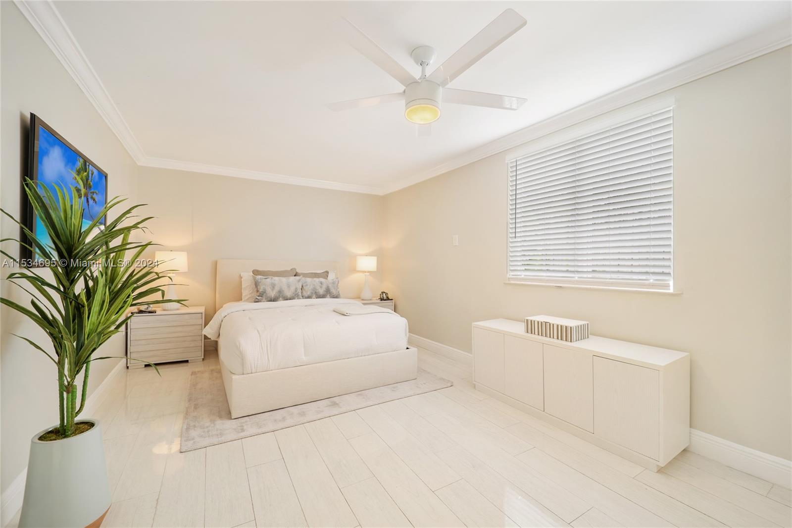 805 Northwest 7th Street Miami, FL 33136 - Photo 15 of 29 a bedroom with a large bed and a couch