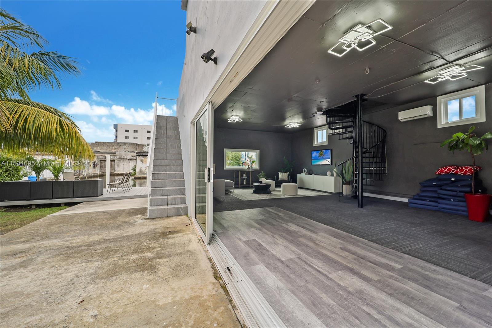 805 Northwest 7th Street Miami, FL 33136 - Photo 19 of 29 a view of a livingroom with furniture and a garage