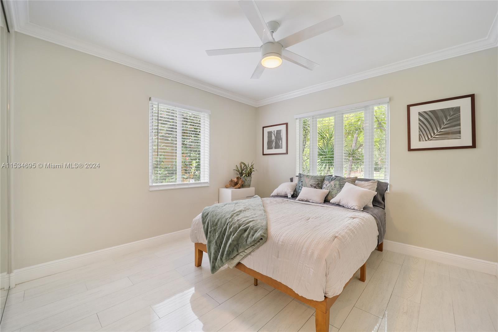805 Northwest 7th Street Miami, FL 33136 - Photo 25 of 29 a bedroom with a bed and a window