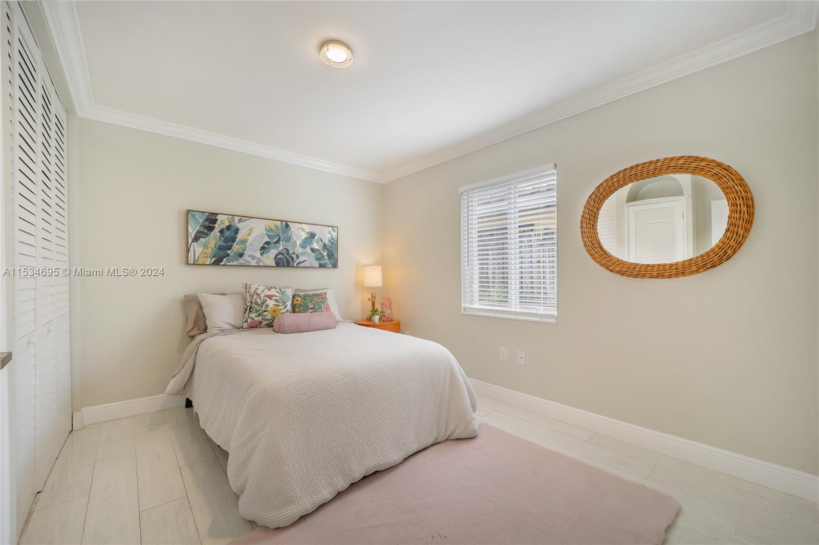 805 Northwest 7th Street Miami, FL 33136 - Photo 27 of 29 a bedroom with a bed and a window