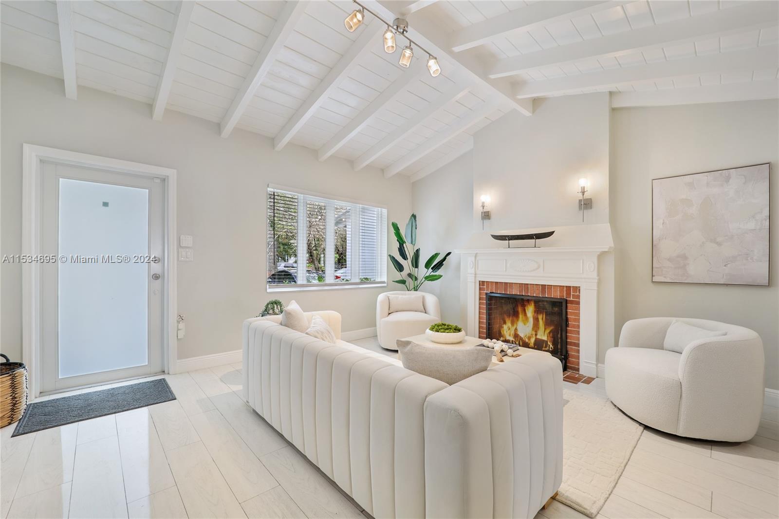 805 Northwest 7th Street Miami, FL 33136 - Photo 7 of 29 a living room with furniture and a fireplace