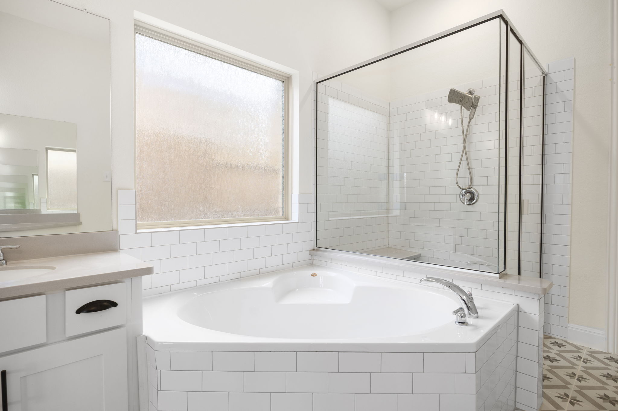 1098 Cherrystone Loop Buda, TX 78610 - Photo 18 of 37 a white bath tub sitting next to a white sink and a shower