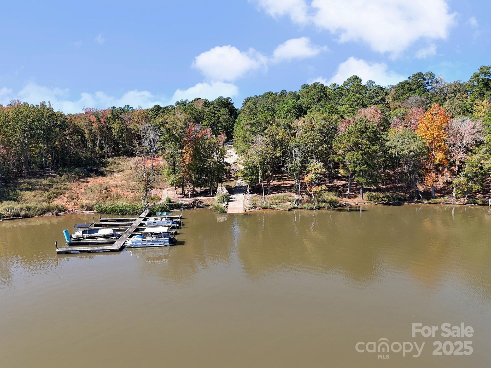 1199 Brunson Road Fort Lawn, SC 29714 - Photo 11 of 48 a view of a lake with boats and trees