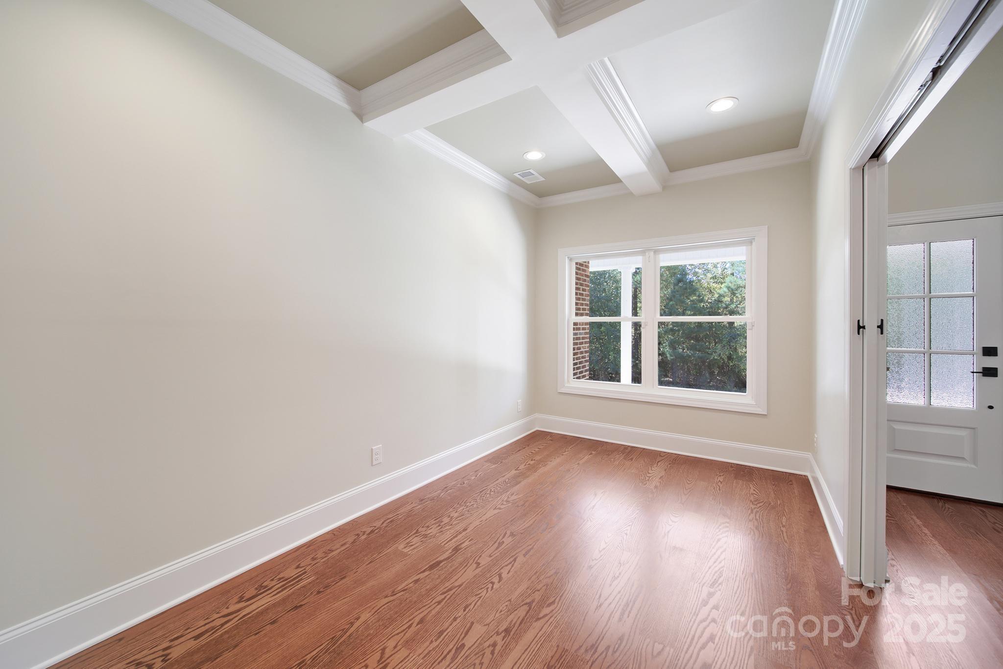 1199 Brunson Road Fort Lawn, SC 29714 - Photo 15 of 48 an empty room with wooden floor and windows