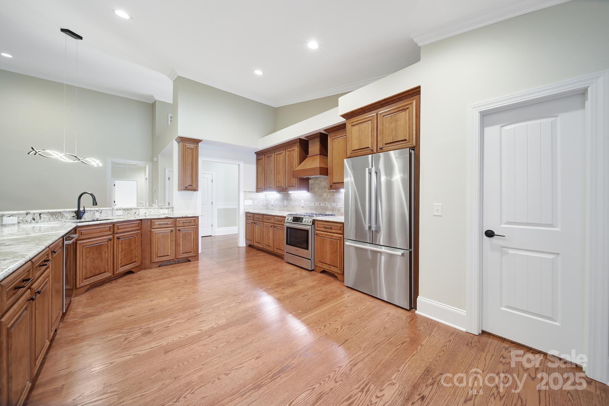 1199 Brunson Road Fort Lawn, SC 29714 - Photo 18 of 48 a large kitchen with stainless steel appliances and a refrigerator