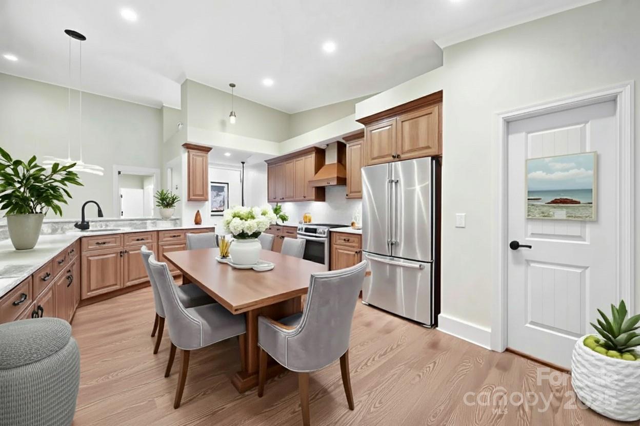 1199 Brunson Road Fort Lawn, SC 29714 - Photo 19 of 48 a kitchen with a refrigerator a table and chairs in it