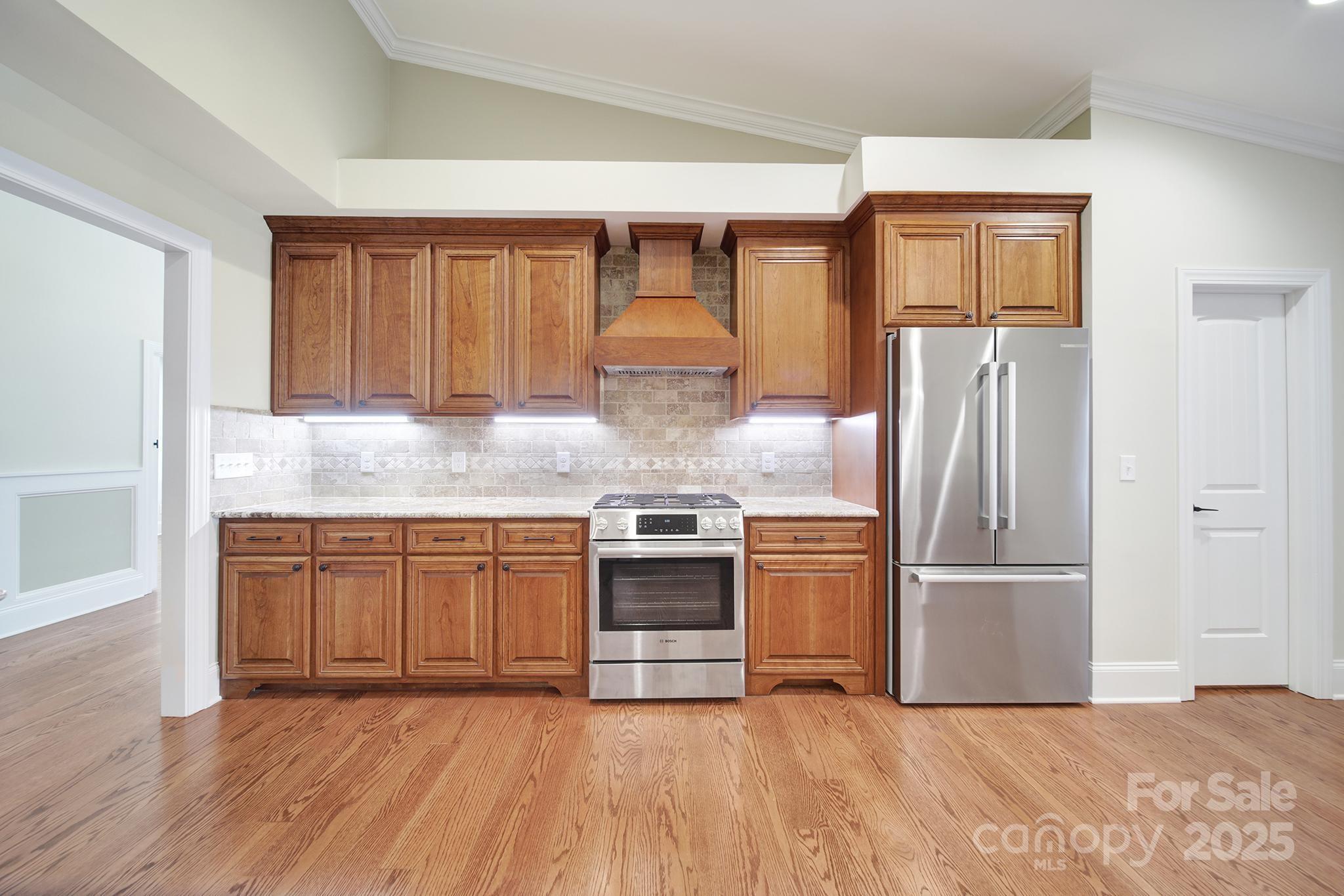 1199 Brunson Road Fort Lawn, SC 29714 - Photo 21 of 48 a kitchen with stainless steel appliances granite countertop a refrigerator and a stove top oven