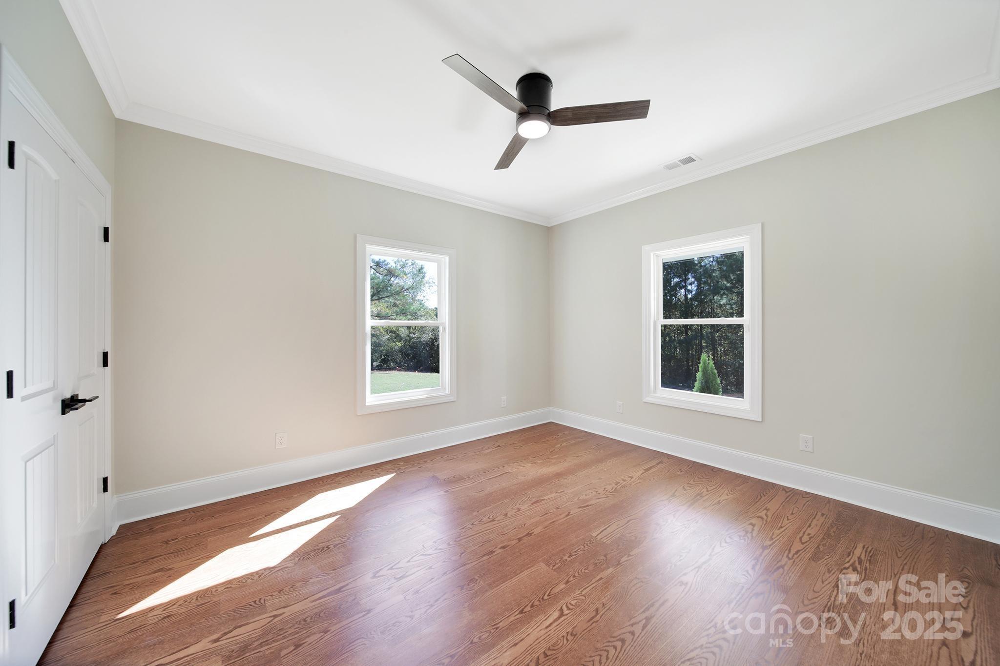 1199 Brunson Road Fort Lawn, SC 29714 - Photo 32 of 48 a view of an empty room with a window and wooden floor