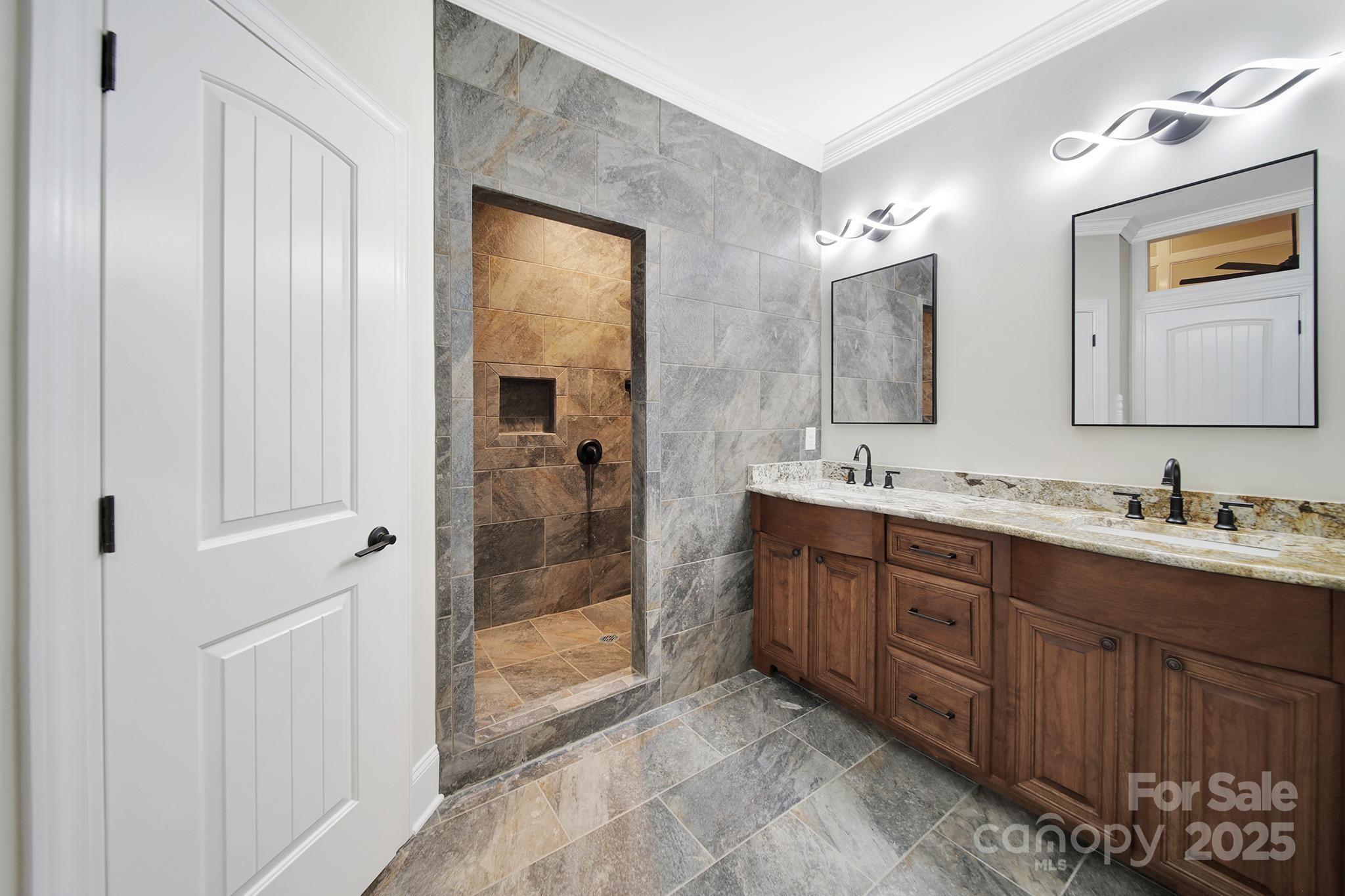 1199 Brunson Road Fort Lawn, SC 29714 - Photo 38 of 48 a spacious bathroom with a granite countertop sink mirror and shower