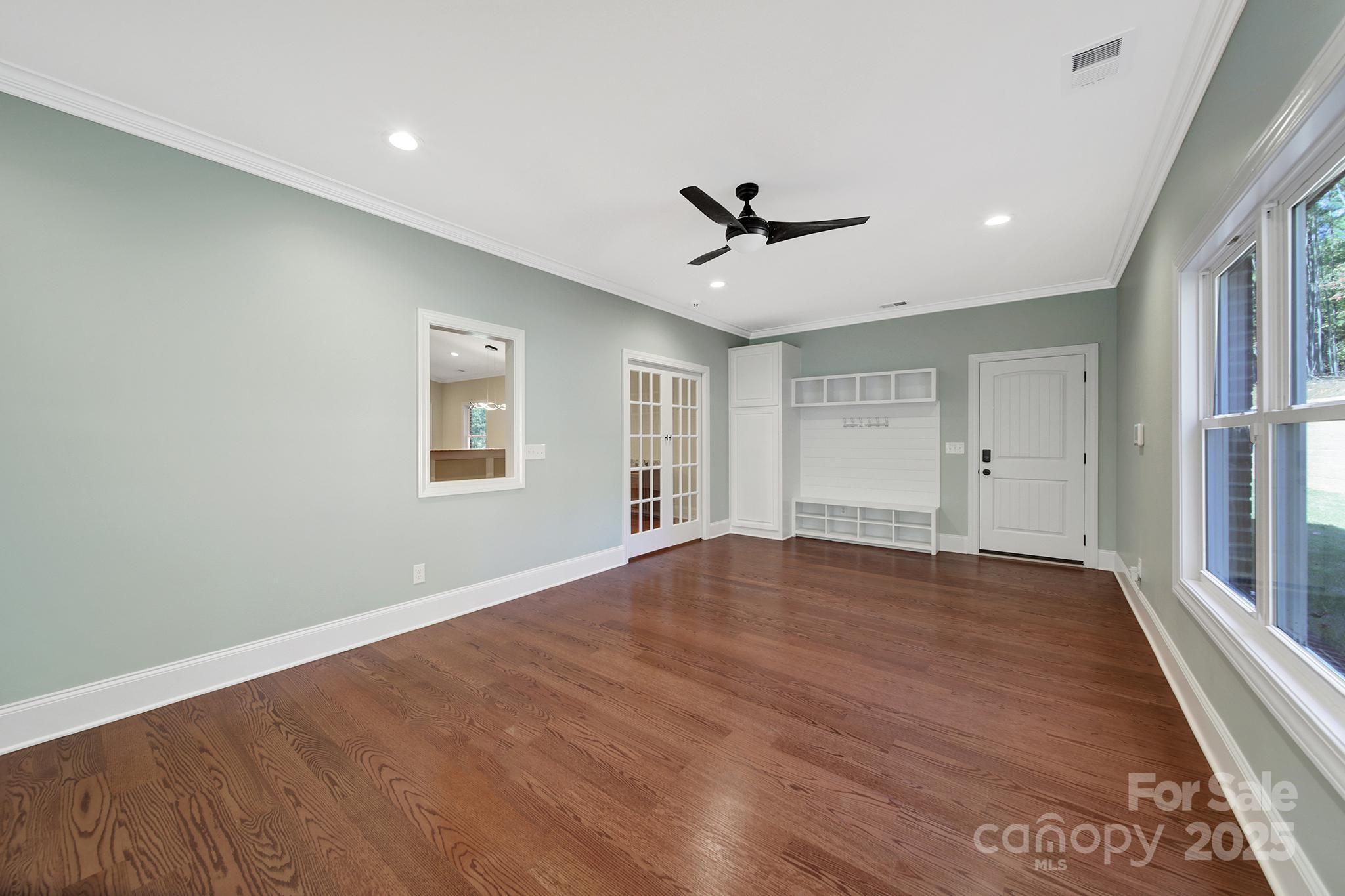 1199 Brunson Road Fort Lawn, SC 29714 - Photo 40 of 48 a view of empty room with wooden floor and fan