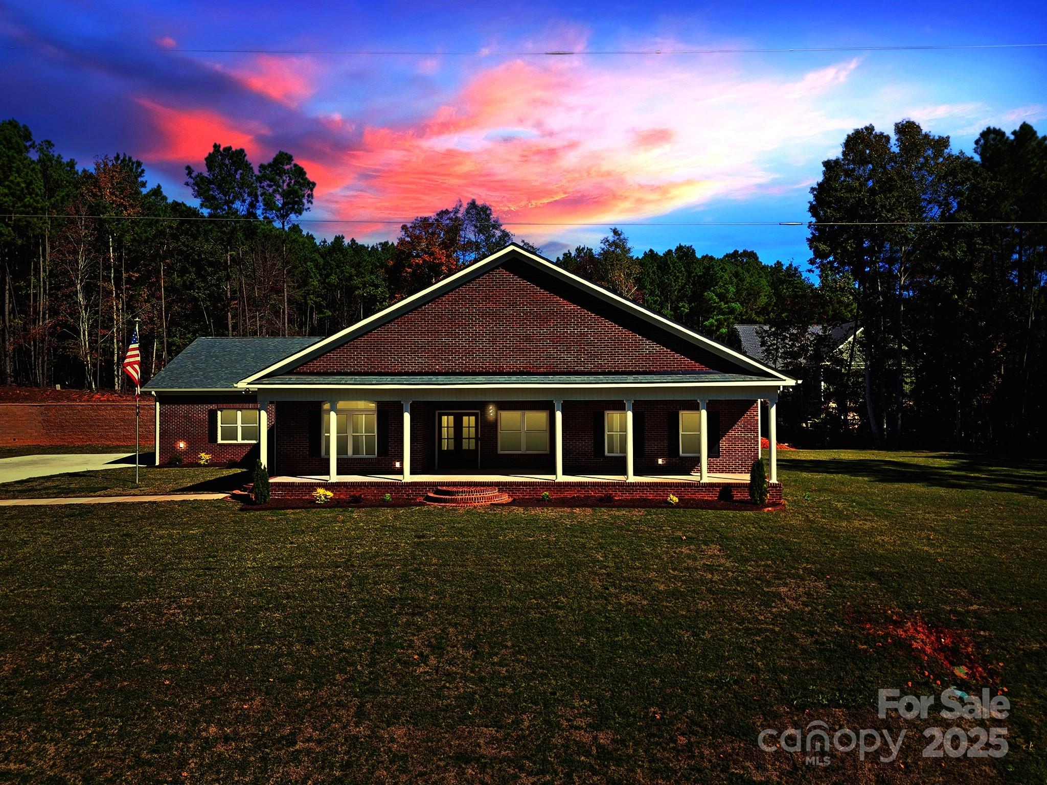 1199 Brunson Road Fort Lawn, SC 29714 - Photo 4 of 48 a front view of a house with a garden