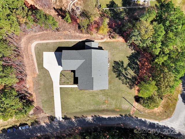 a large kitchen with stainless steel appliances and a refrigerator