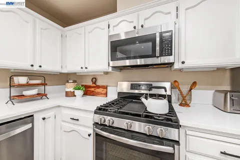 a kitchen with a sink and a window