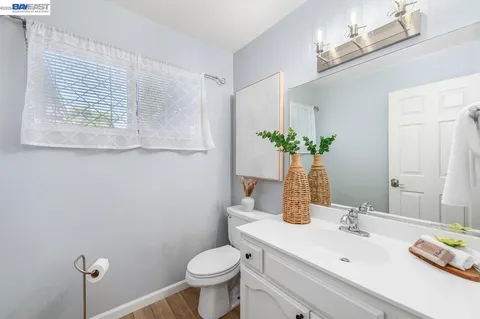 a view of a kitchen with wooden floor