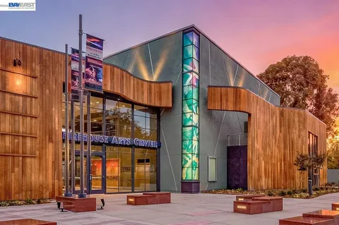 a view of a brick house with a large windows