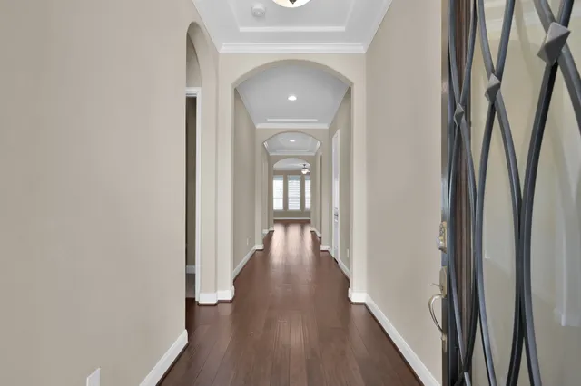 a view of hallway with wooden floor