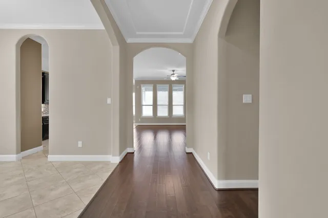 wooden floor in a hall with a window