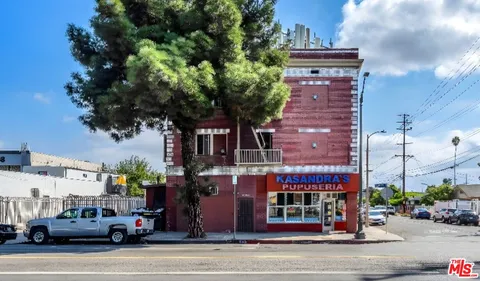 a view of a street with cars