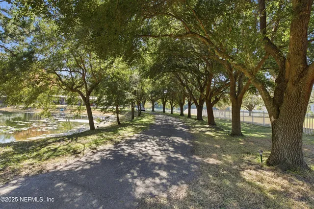 a front view of a house with a yard outdoor seating and garage