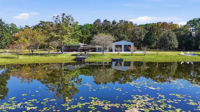 a view of a house with a yard balcony and sitting area