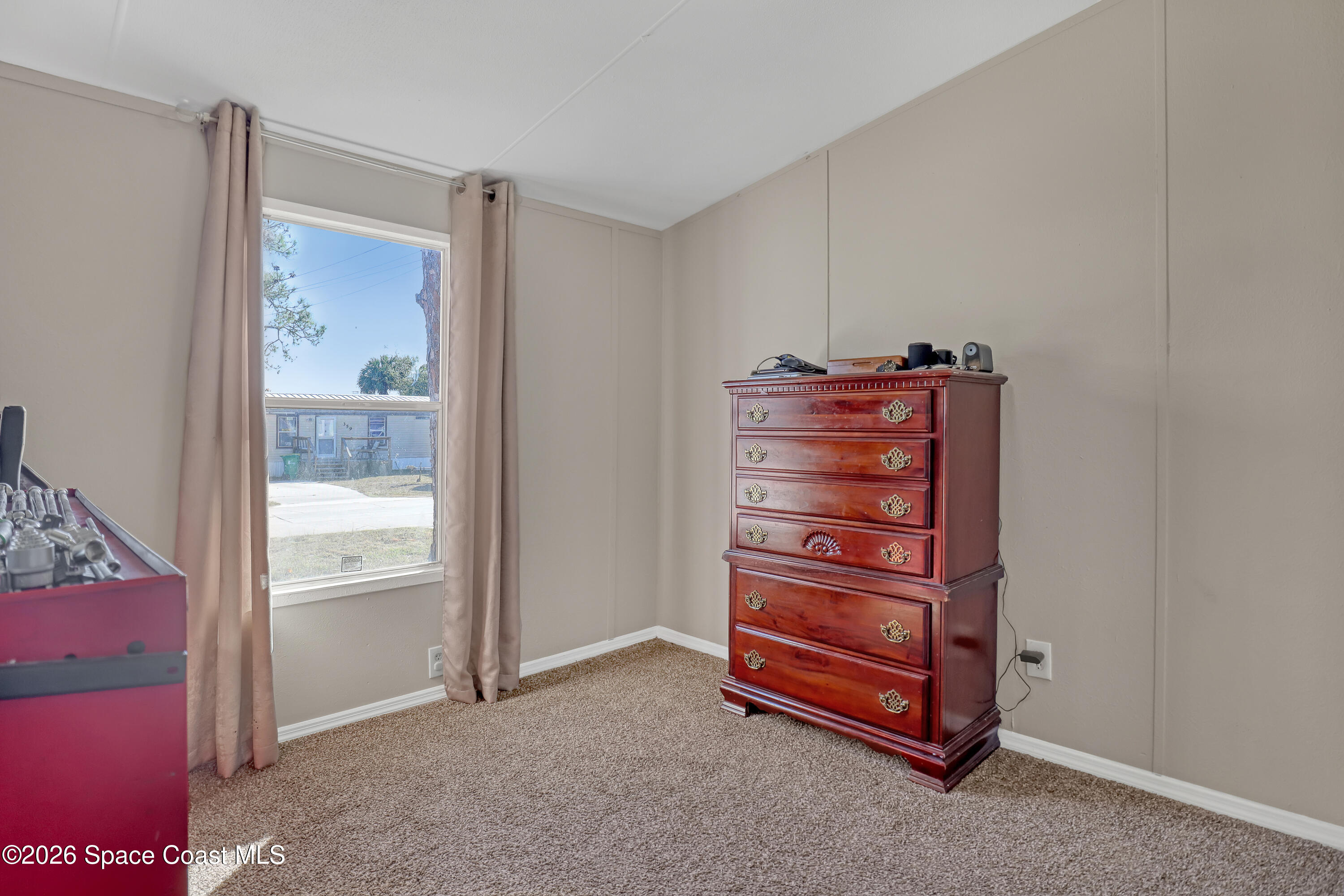 354 Akorn Street Cocoa, FL 32927 - Photo 14 of 29 a view of an empty room and a bathroom