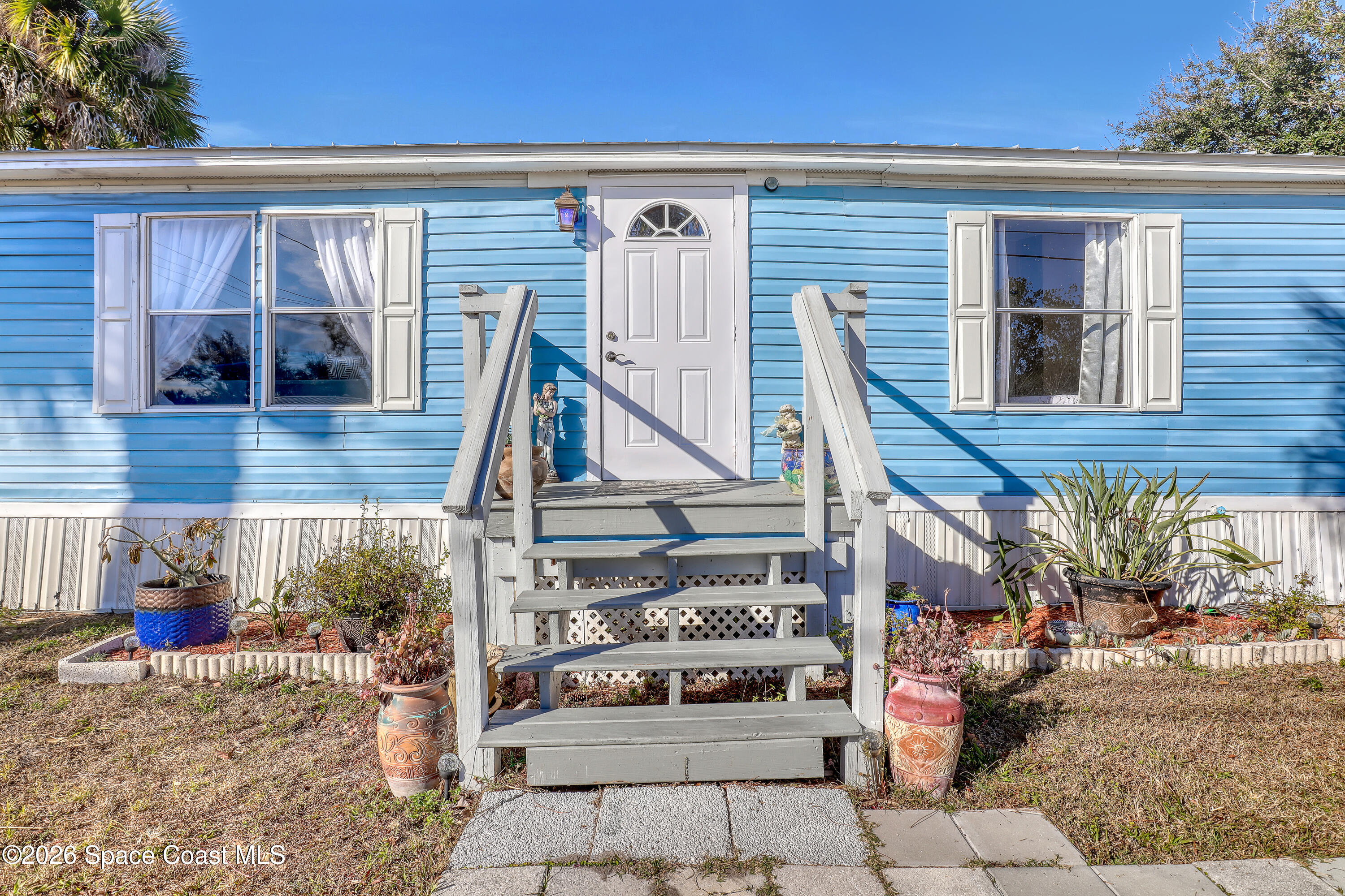 354 Akorn Street Cocoa, FL 32927 - Photo 21 of 29 a view of a house with a patio