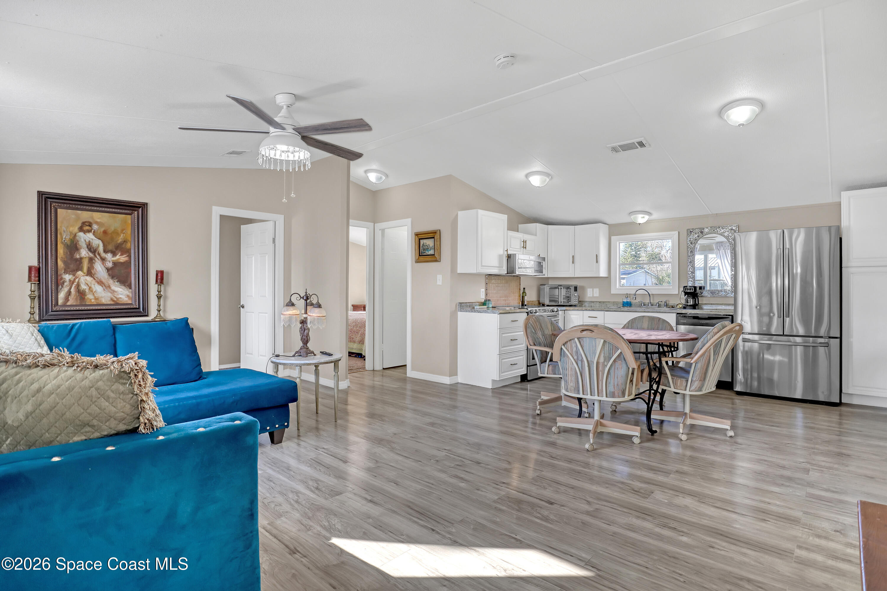 354 Akorn Street Cocoa, FL 32927 - Photo 23 of 29 a living room with furniture and kitchen view