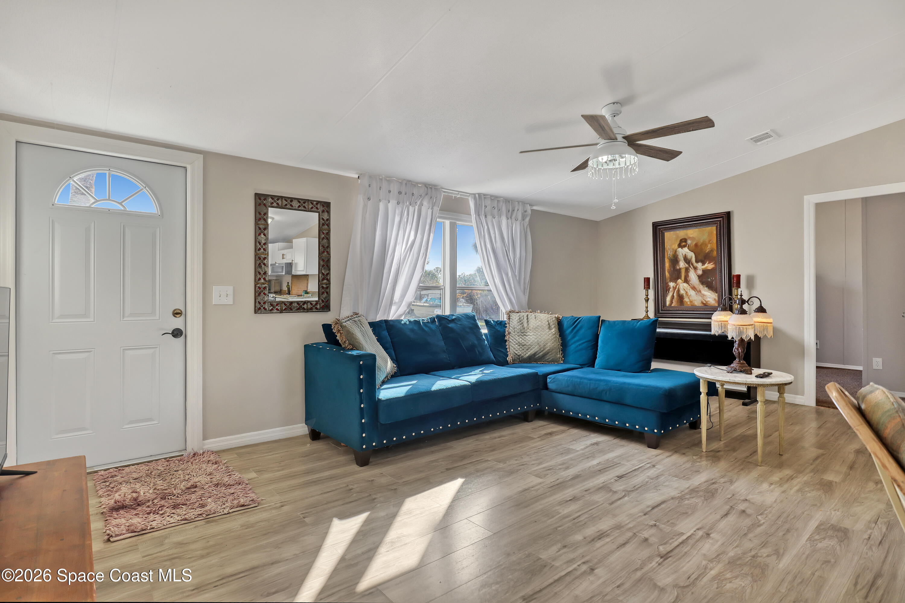 354 Akorn Street Cocoa, FL 32927 - Photo 24 of 29 a living room with furniture and a window