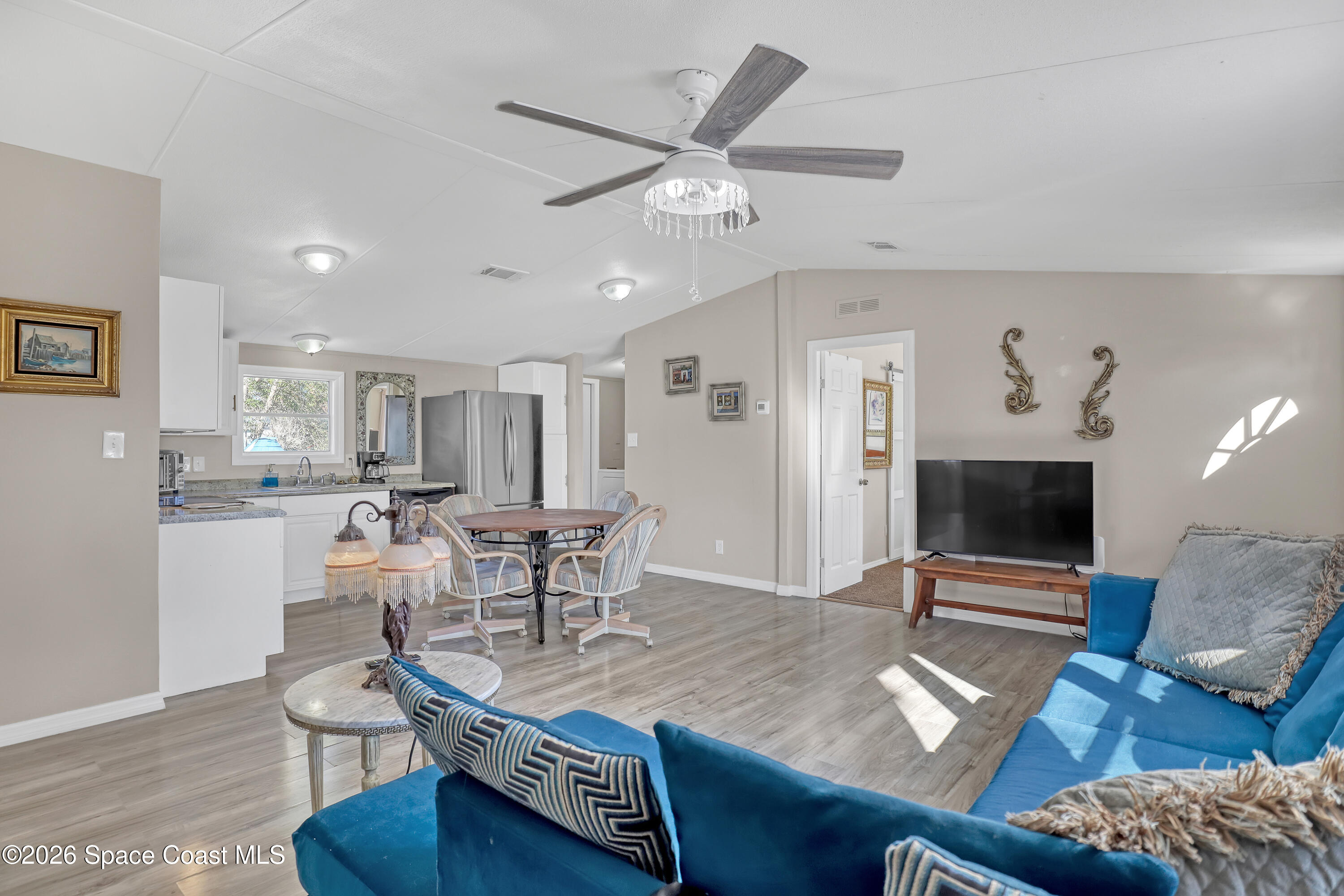 354 Akorn Street Cocoa, FL 32927 - Photo 26 of 29 a living room with furniture and a wooden floor