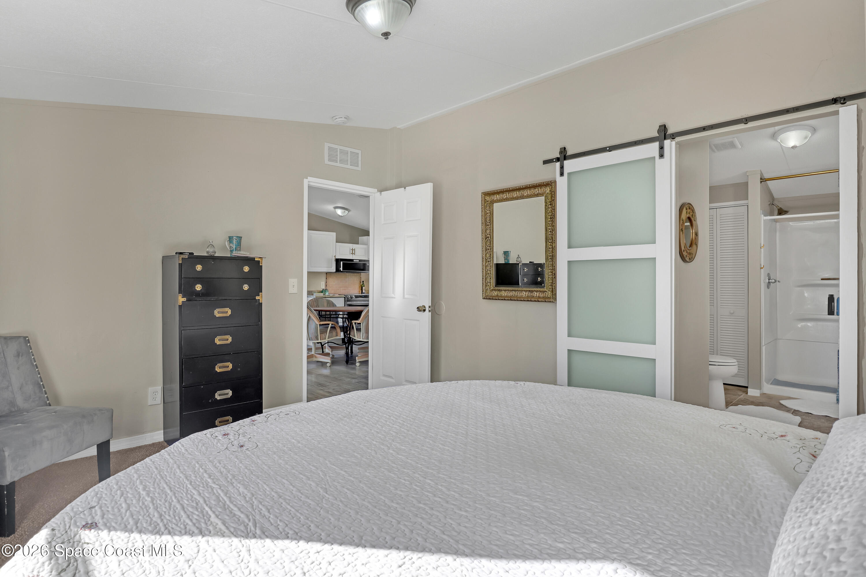 354 Akorn Street Cocoa, FL 32927 - Photo 9 of 29 a bedroom with a bed and a bathroom