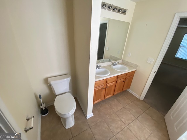 530 Shire Lane Fairburn, GA 30213 - Photo 15 of 36 a bathroom with a toilet sink and mirror