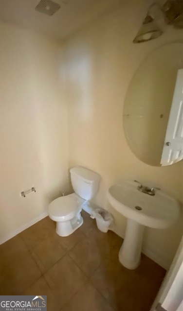 530 Shire Lane Fairburn, GA 30213 - Photo 19 of 36 a white toilet sitting next to a bathroom sink