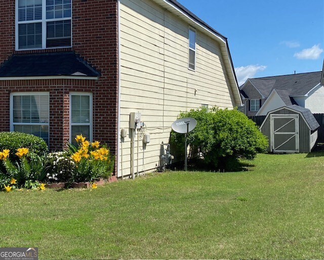 530 Shire Lane Fairburn, GA 30213 - Photo 32 of 36 a front view of a house with a garden