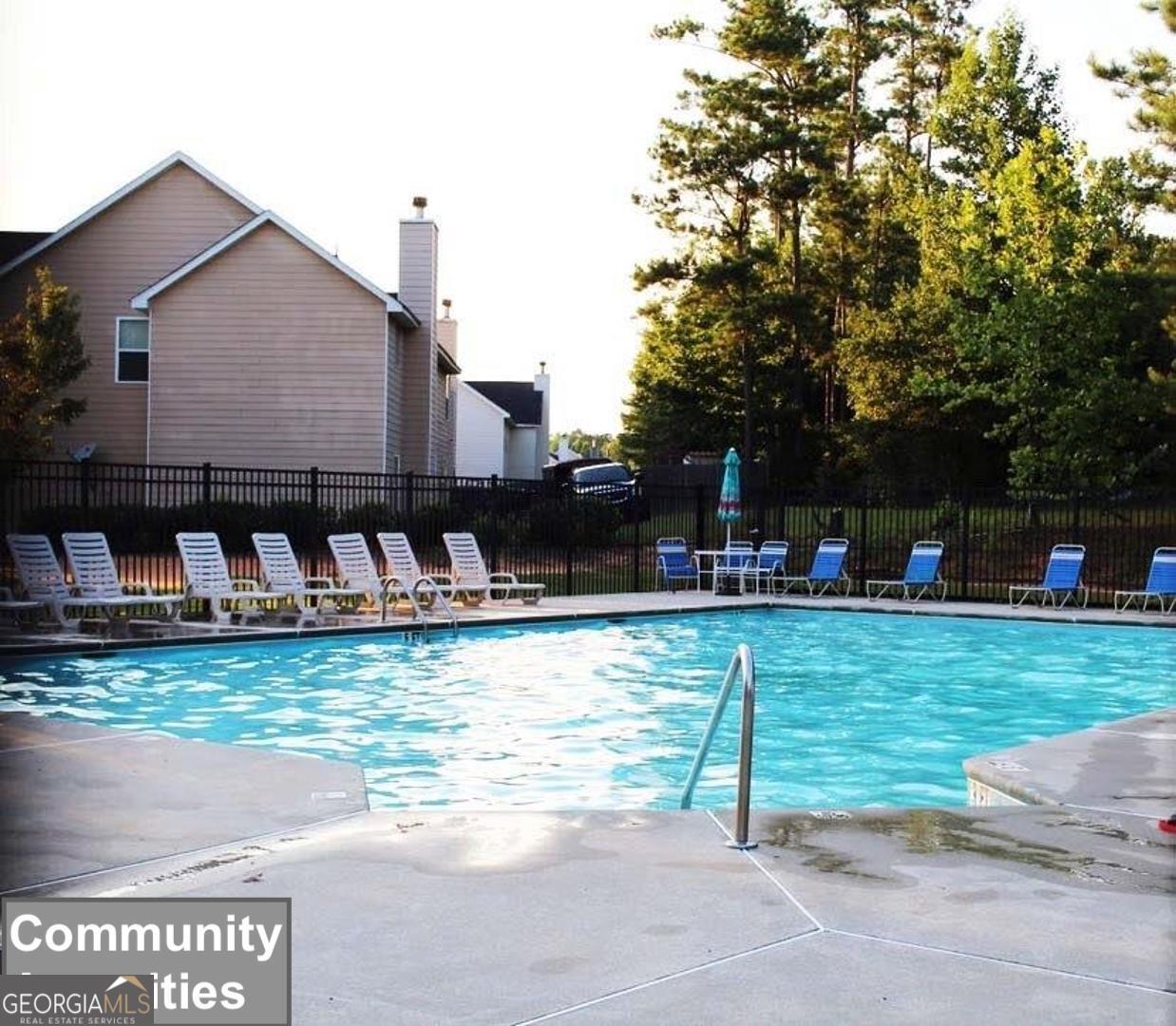 530 Shire Lane Fairburn, GA 30213 - Photo 34 of 36 a swimming pool with outdoor seating and yard