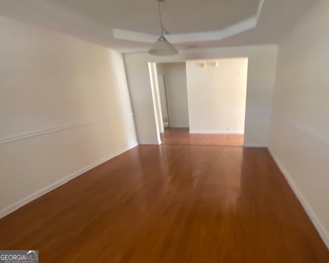 530 Shire Lane Fairburn, GA 30213 - Photo 6 of 36 an empty room with wooden floor and windows