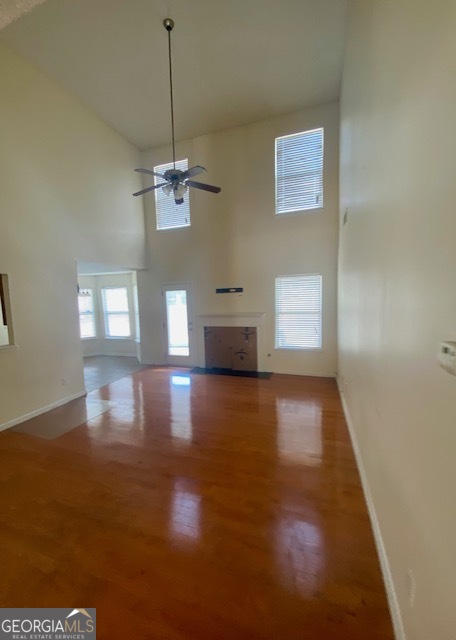 530 Shire Lane Fairburn, GA 30213 - Photo 7 of 36 a view of a room with wooden floor staircase and windows