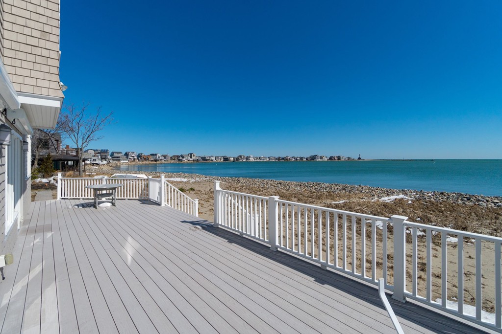 126-128 Jericho Road Scituate, MA 02066 - Photo 1 of 29 a view of roof deck with two chairs and wooden floor