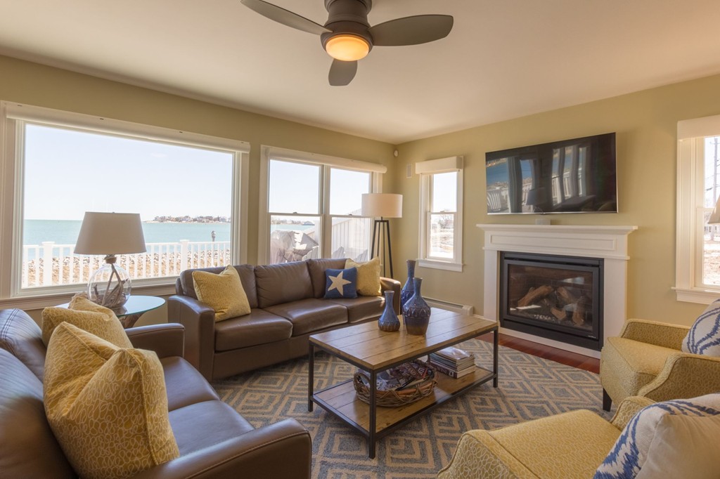 126-128 Jericho Road Scituate, MA 02066 - Photo 13 of 29 a living room with furniture and a fireplace