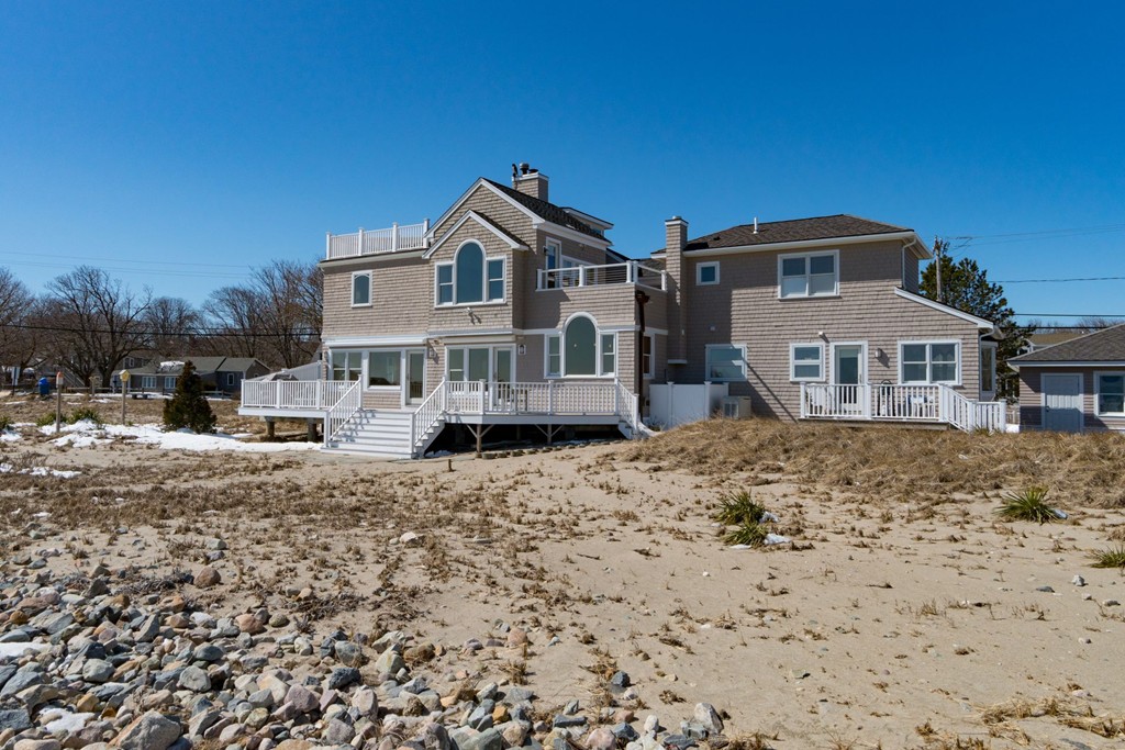 126-128 Jericho Road Scituate, MA 02066 - Photo 2 of 29 a front view of a house with a yard