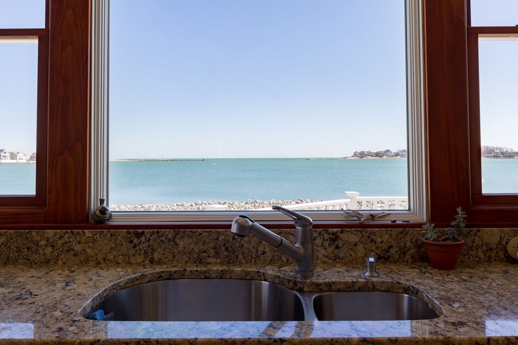 126-128 Jericho Road Scituate, MA 02066 - Photo 8 of 29 a view of a sink and dishwasher next to a window