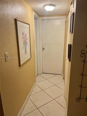 a view of a workspace with furniture