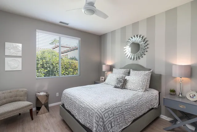 a bedroom with a bed and a chair