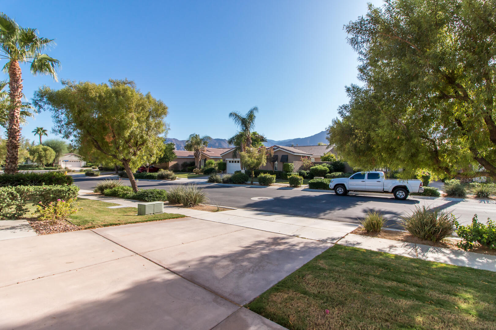 60290 Sweetshade Lane La Quinta, CA 92253 - Photo 17 of 28 a view of swimming pool with outdoor seating and a garden