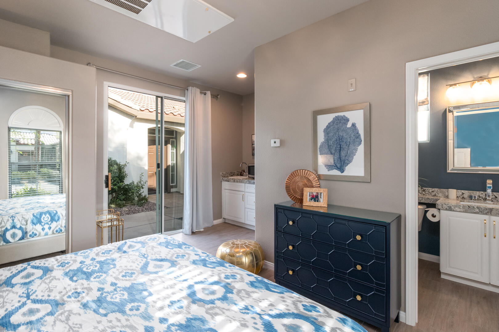 60290 Sweetshade Lane La Quinta, CA 92253 - Photo 18 of 28 a bedroom with a bed and a dresser