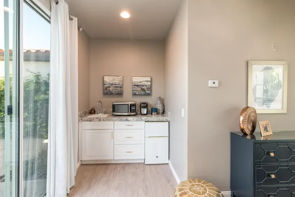 a room with a bed and a dresser