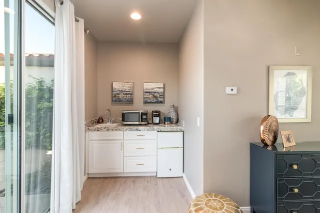 a room with a bed and a dresser